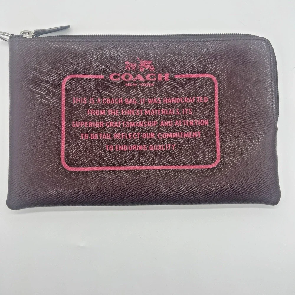 Coach Storypouch Pebbled Leather Zip Clutch Pouch Dark Burgundy Pink Creed Logo‎